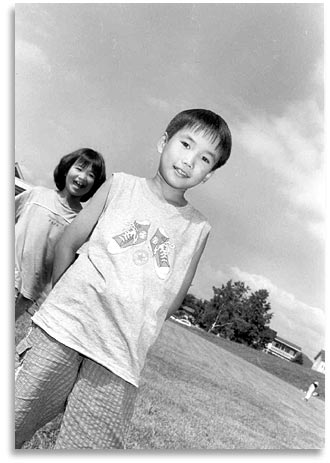 “Brother and Sister”.  At the garden party at Hagoromo Park in Higashikawa, Hokkaido.  July 2001.