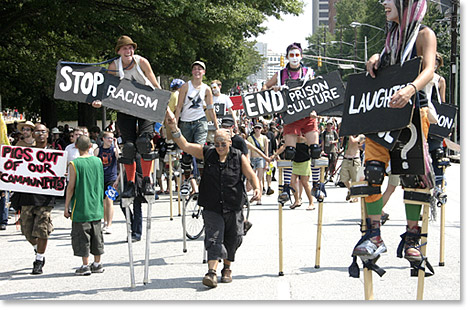 Signs on stilts / Stop Racism / End Prison Culture