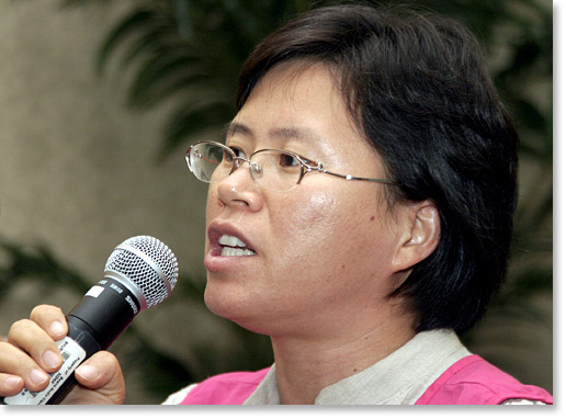 Sin Moon-hee of the Korean Women Peasants Alliance, Korea, speaks against "Free Trade."