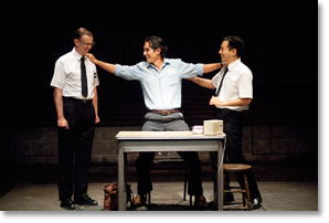 Juan José (René Millán) thanks his backers in support of his citizenship (David Kelly, left, and Daisuke Tsuji, right). Photo by Jenny Graham.