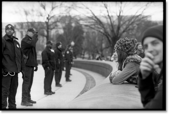 The permit only allowed protesters to be on the lawn area of the Capitol on January 17, 2012 for the National Action calling all occupations to "Occupy Congress." Any attempt to go forth was met with police action including arrest.  Pictured here is a woman glaring in the direction of the Capitol Police showing no signs of being intimidated by the police line. All photos and captions by Johnny Nguyen.