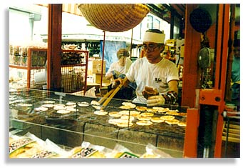 “Rice Cakes”. Cooking rice cakes in Asakusa, Tokyo. August 2000