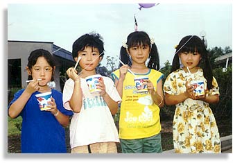 “Cute Kids”. At the Dontokoi Festival in Higashikawa, Japan. July 2000.