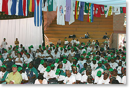 Delegates sit below flags from around the world.