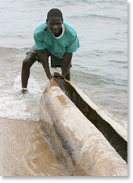 Carlito Milage manoeuvres a fishing canoe in Meponda on the shores of Lake Niassa.