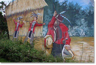 A mural at the Tanayiku Natural Ecology Park depicts a Tsou traditional method of catching fish. The Park was created by, and is owned and operated by, the community. In addition to the natural ecology of the park itself, traditional Tsou culture dances are performed and Tsou cooking is available.