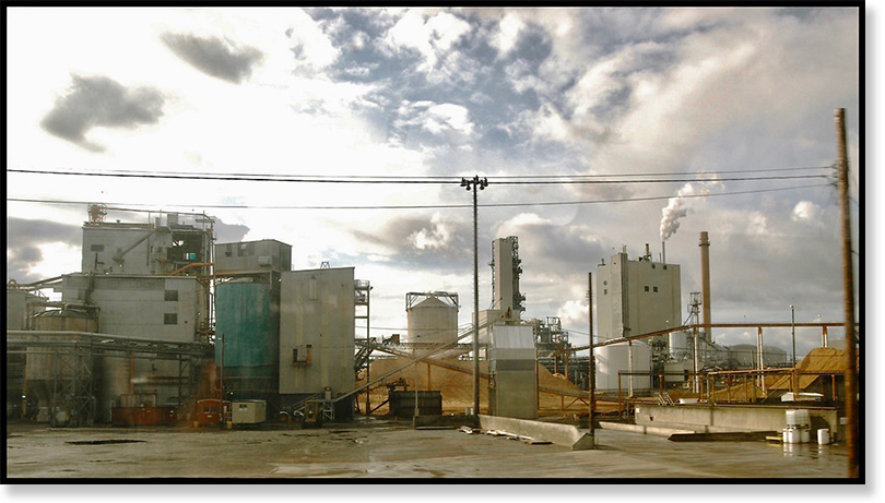 American factory as seen from a passing train. Photo by Tom G via Creative Commons.