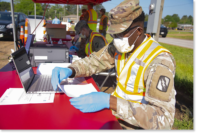 Mississippi National Guard unit administers Covid-19 tests. Photo via Creative Commons.