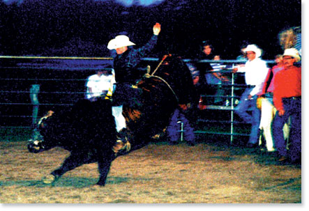 Bull riding at the M Bar M Ranch, Santa Fe, Texas. Photo by Nic Paget-Clarke.
