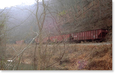 A coal train disappears into the hazy woods. Dickinson county, Virginia. Photo by Nic Paget-Clarke.