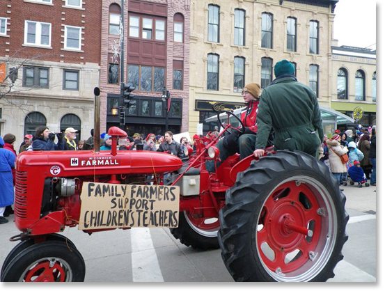 The Farmer Labor Tractorade of 53 tractors drives into Madison, Wisconsin on Saturday March 12, 2011. Photo by Ruth Simpson