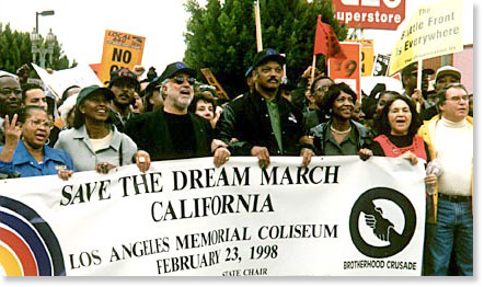 At the Save The Dream March, Los Angeles, February 23, 1998: Brotherhood Crusade state chair Danny Bakewell, Rev. Jesse Jackson, Congresswoman Maxine Waters, UFW Vice President Dolores Huerta, Rabbi Jacobs. Photo by Butch Wing